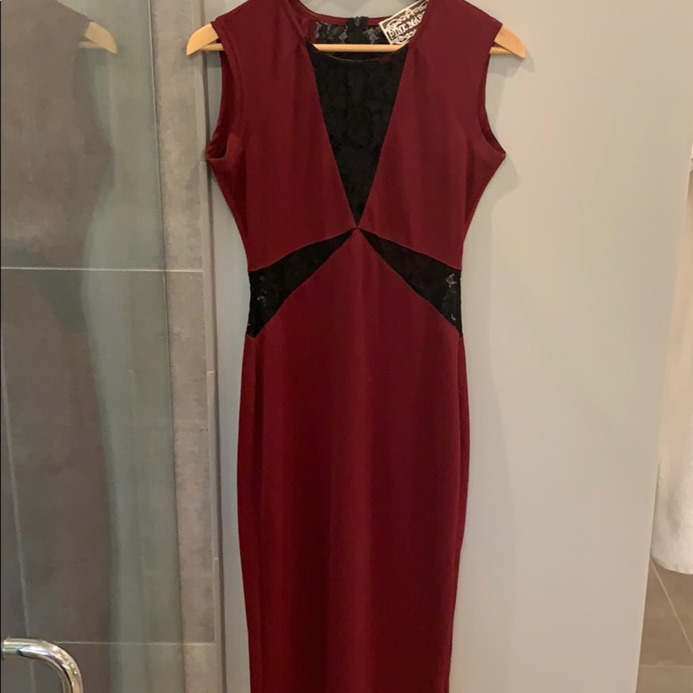 Red midi with black lace cutouts